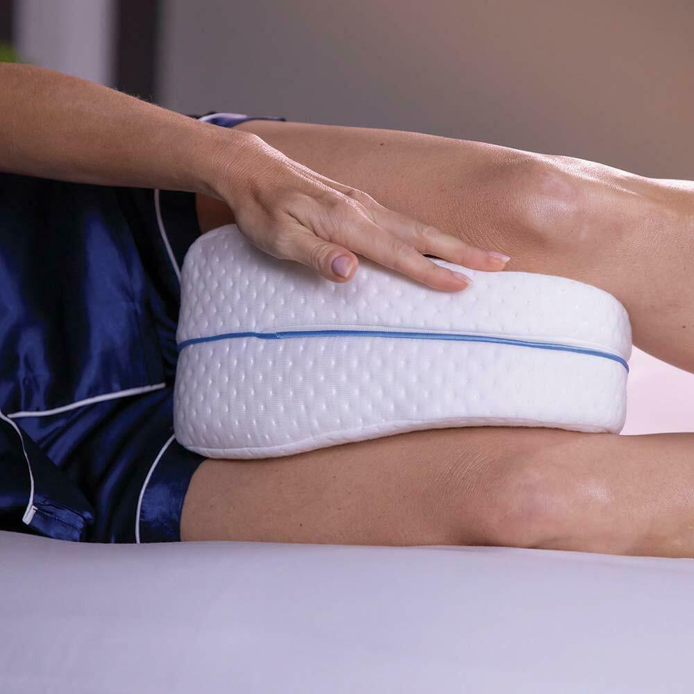 Almohada entre las rodillas